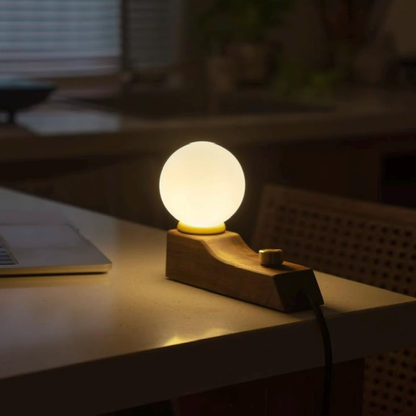 Lampe de table minimaliste à socle incurvé et globe lumineux